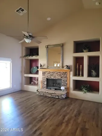 a living room with a fireplace and a fireplace