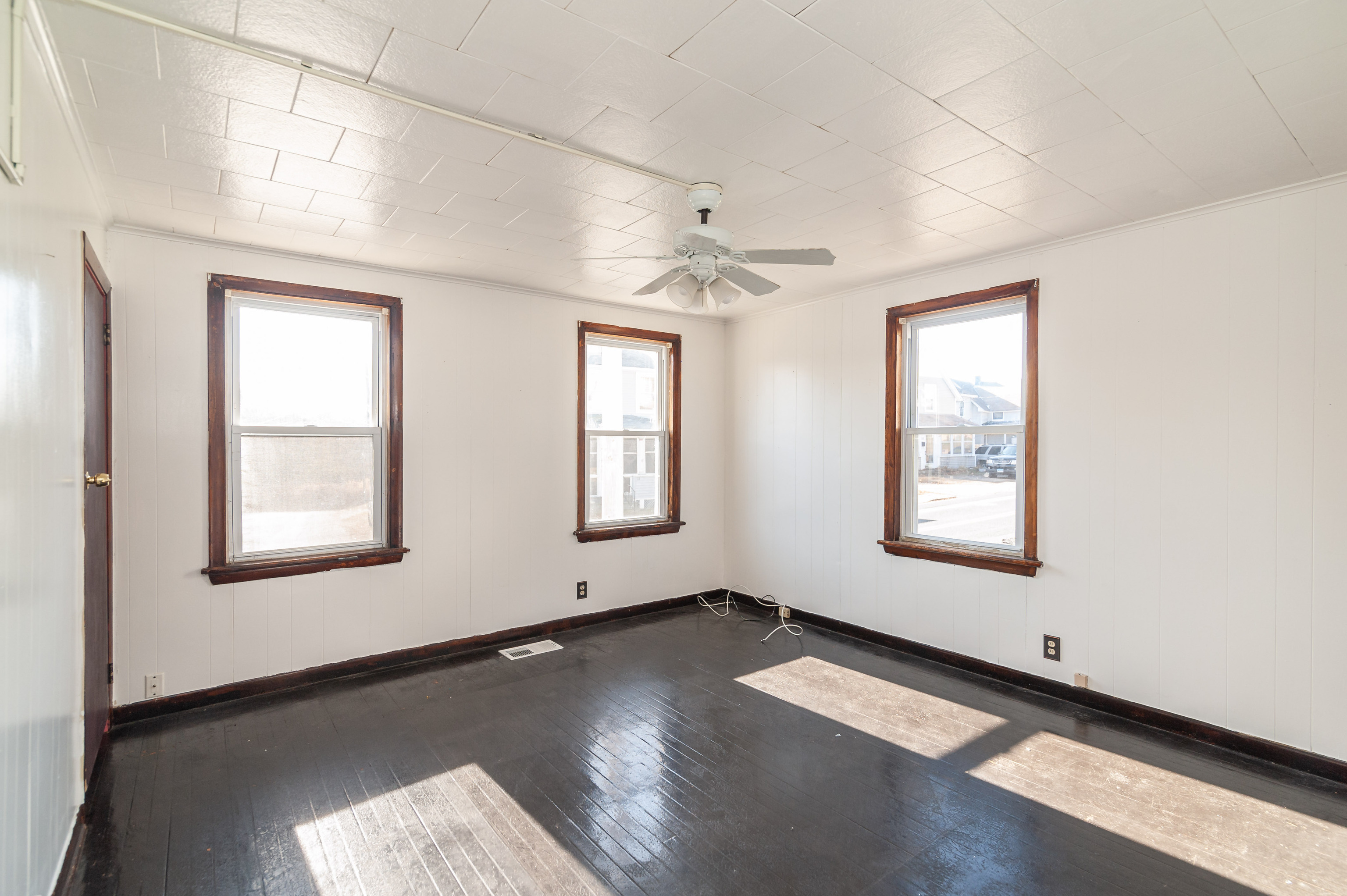 29 Dunham Street Norwich, CT 06360 - Photo 21 of 33 an empty room with wooden floor and windows