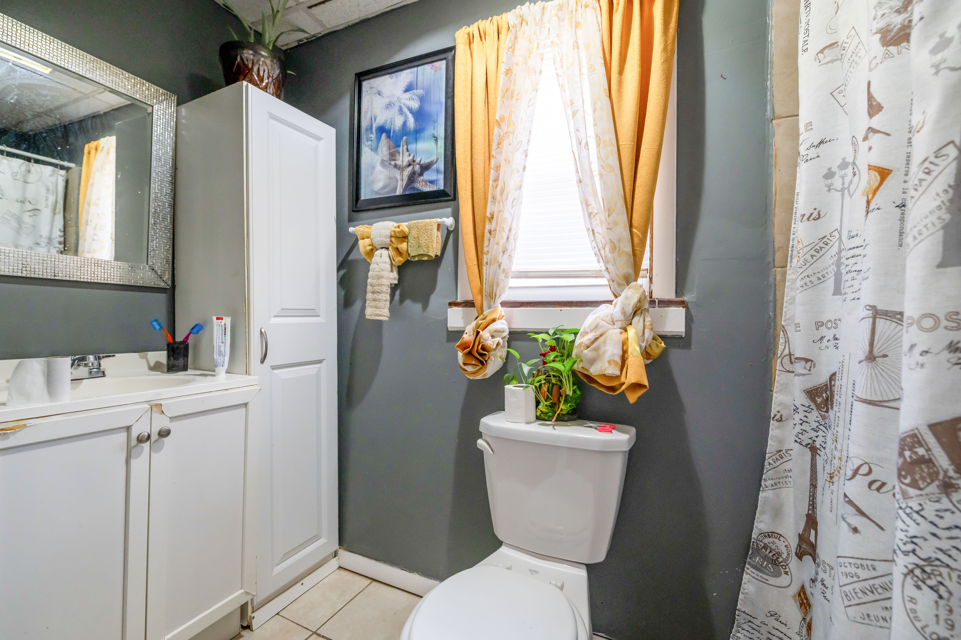 29 Dunham Street Norwich, CT 06360 - Photo 22 of 33 a white toilet sitting next to a bathroom sink