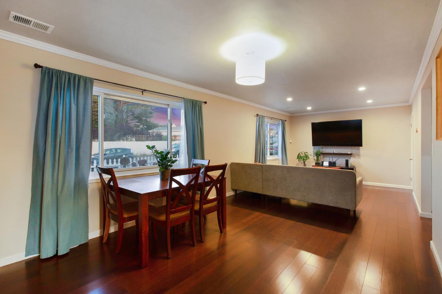412 Lomond Drive Pacifica, CA 94044 - Photo 23 of 26 a living room with furniture a flat screen tv and a large window