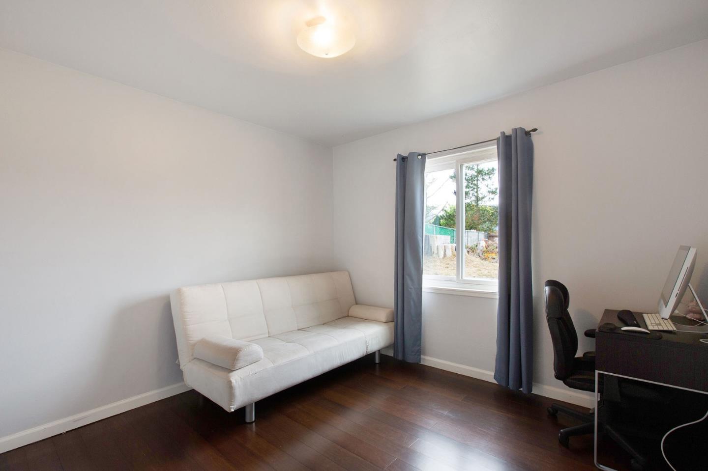 412 Lomond Drive Pacifica, CA 94044 - Photo 9 of 26 a living room with furniture and a window