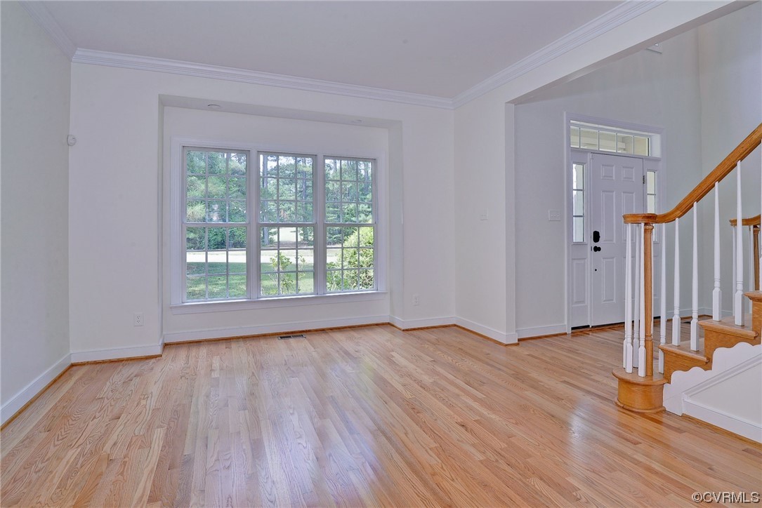 5531 Scotsview Drive Providence Forge, VA 23140 - Photo 17 of 42 a view of an empty room with wooden floor and a window