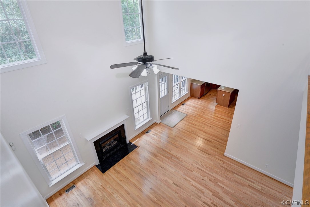 5531 Scotsview Drive Providence Forge, VA 23140 - Photo 23 of 42 a view of a livingroom with wooden floor and a ceiling fan