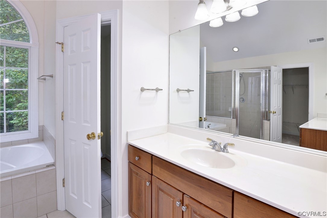 5531 Scotsview Drive Providence Forge, VA 23140 - Photo 27 of 42 a bathroom with a sink double vanity granite tub and shower