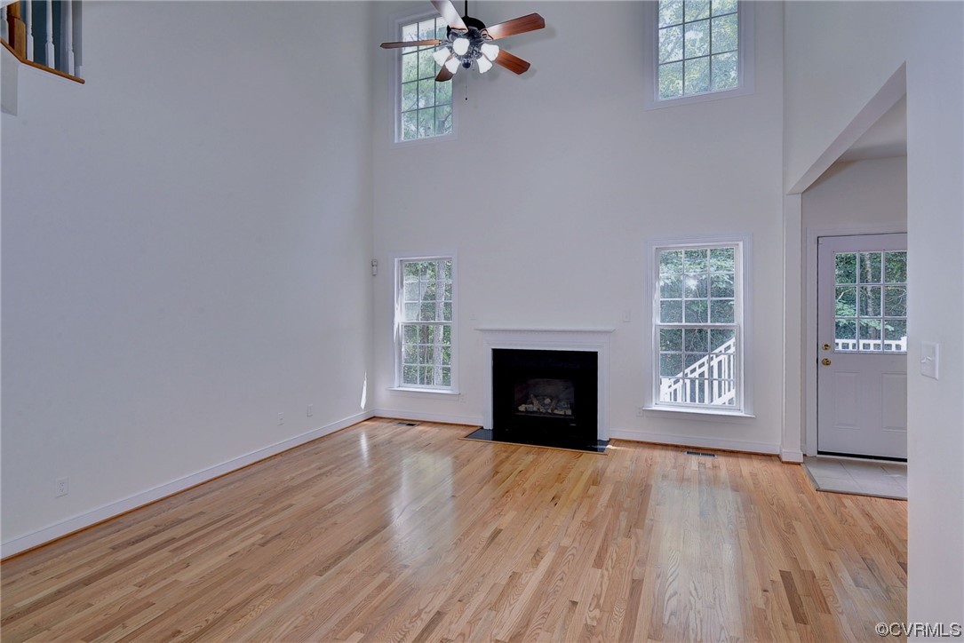 5531 Scotsview Drive Providence Forge, VA 23140 - Photo 6 of 42 a view of empty room with wooden floor and fireplace