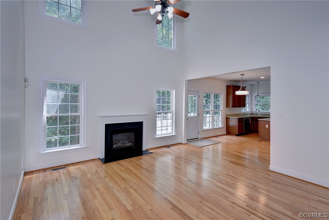 5531 Scotsview Drive Providence Forge, VA 23140 - Photo 7 of 42 wooden floor fireplace and windows in an empty room