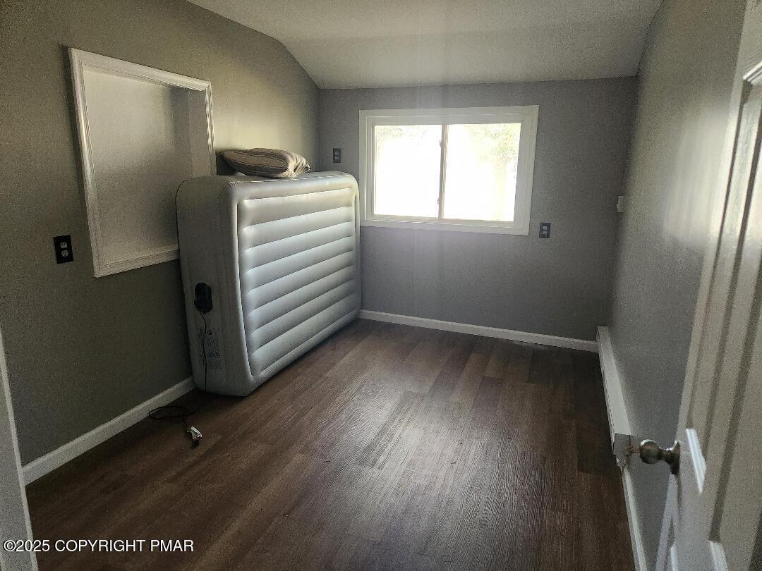 22 Mountain Top Road East Stroudsburg, PA 18302 - Photo 7 of 9 a view of an empty room with a window and wooden floor
