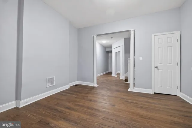 wooden floor with white walls