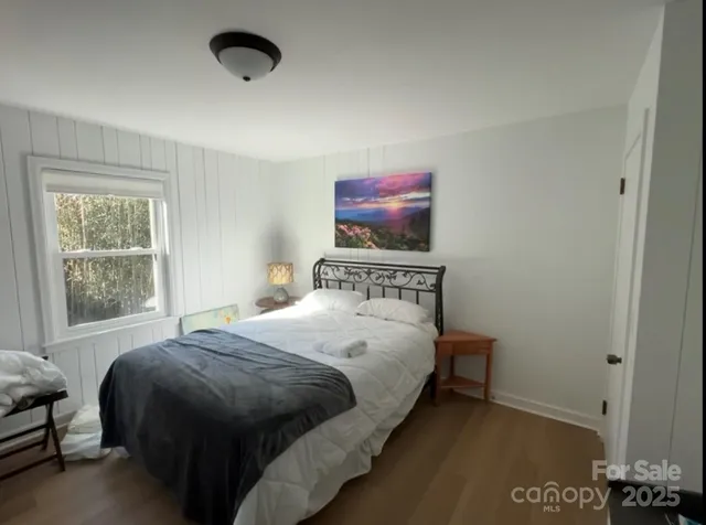 a living room with lots of furniture and chandelier
