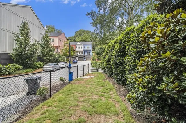 a balcony with tall trees