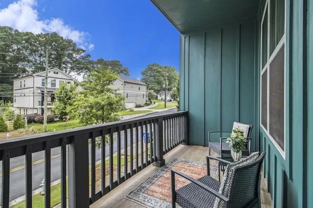 a view of a balcony with furniture