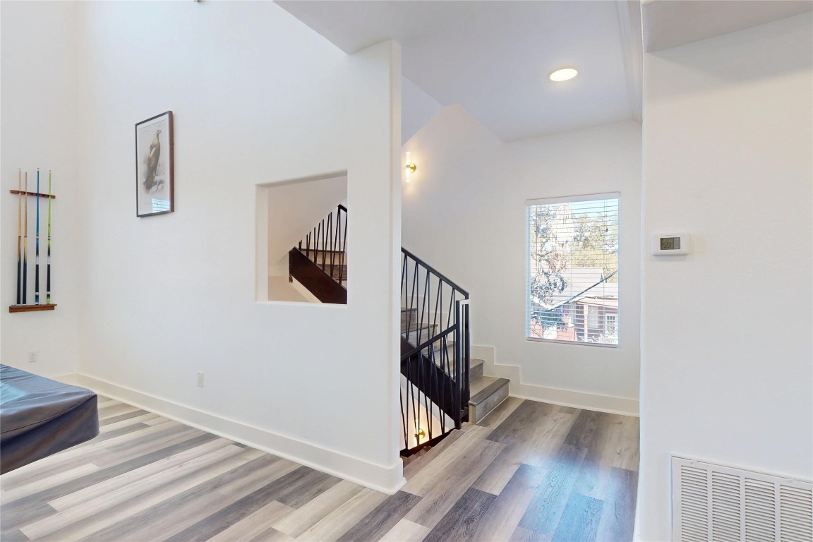 2023 Rosedale Street Houston, TX 77004 - Photo 13 of 30 a view of entryway and hall with wooden floor
