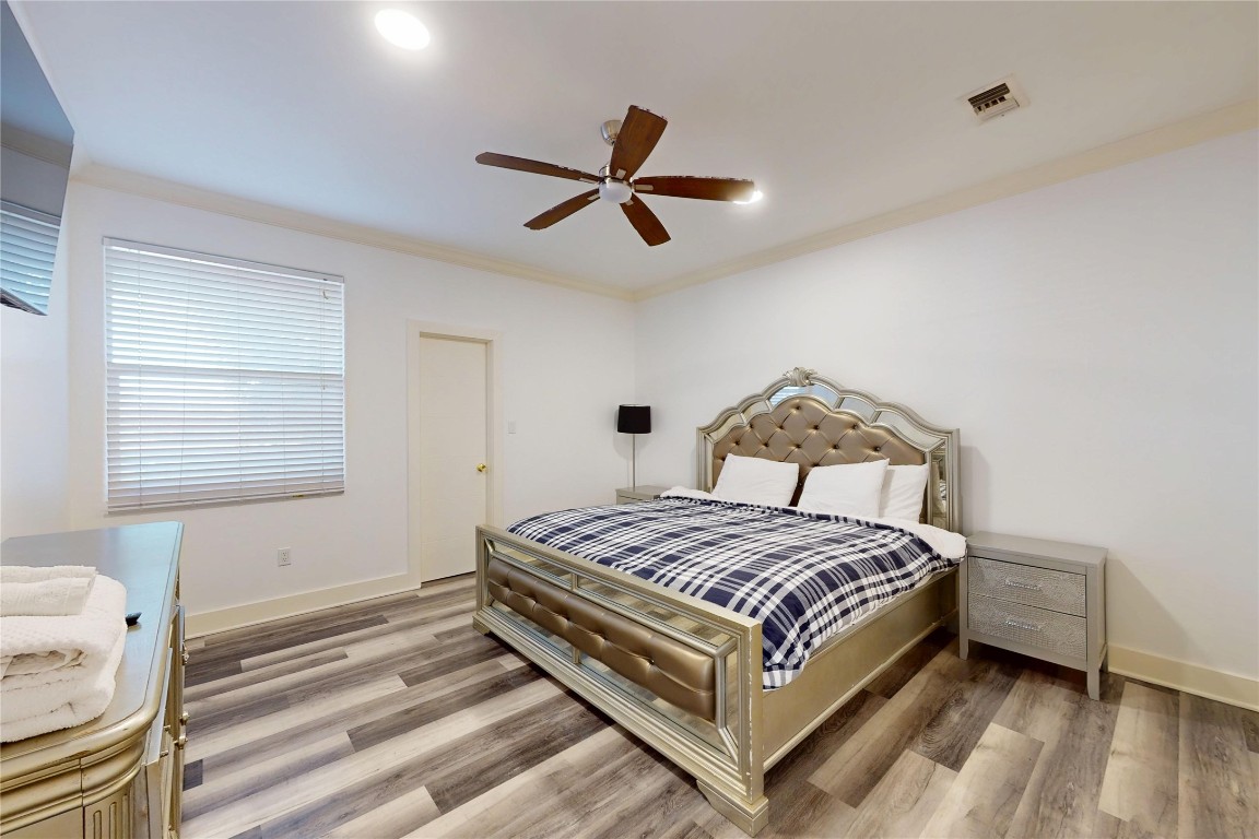 2023 Rosedale Street Houston, TX 77004 - Photo 14 of 30 a bedroom with a bed and window