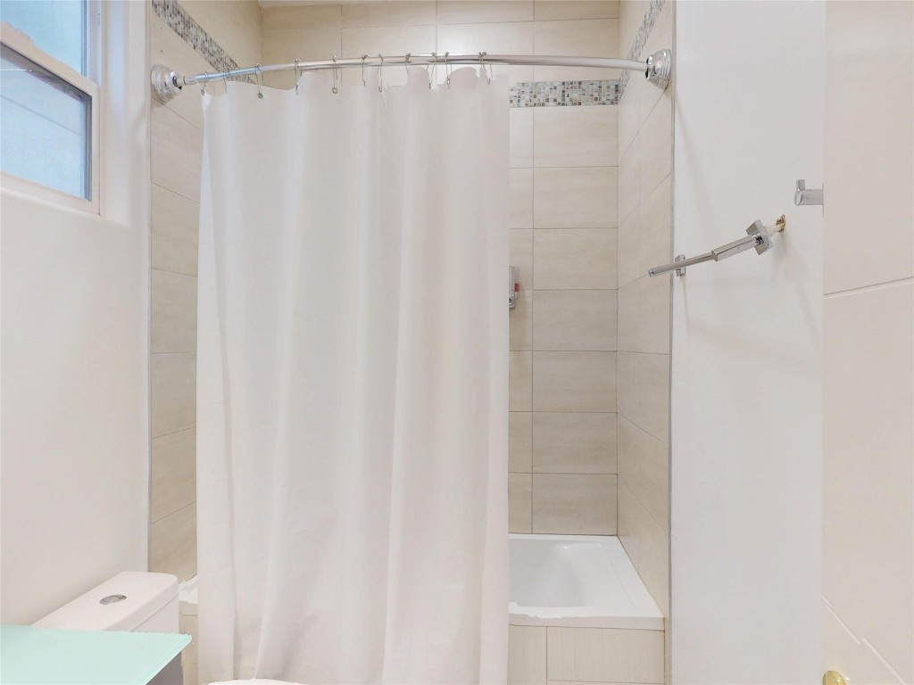 2023 Rosedale Street Houston, TX 77004 - Photo 15 of 30 a bathroom with a shower and a sink