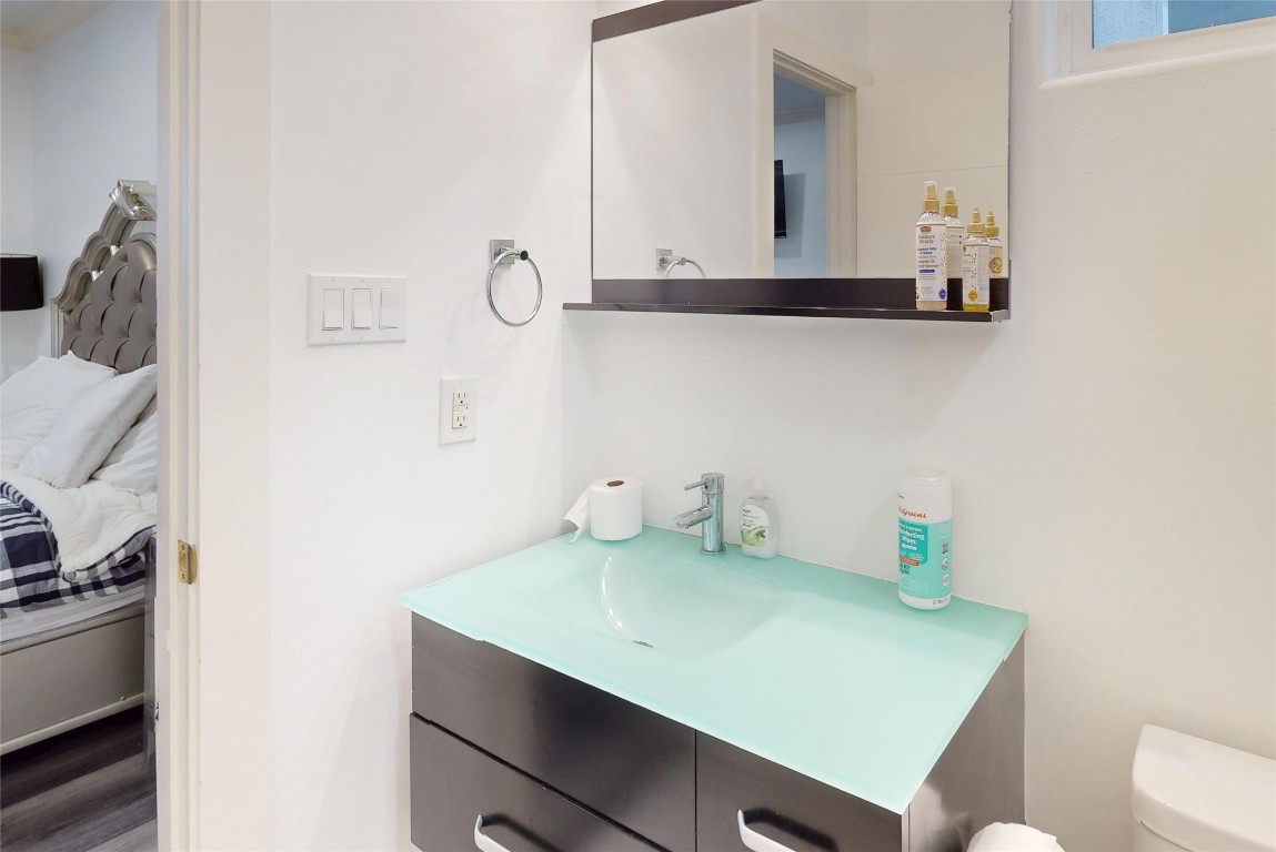 2023 Rosedale Street Houston, TX 77004 - Photo 16 of 30 a bathroom with a sink and a toilet