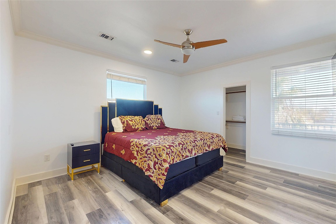 2023 Rosedale Street Houston, TX 77004 - Photo 17 of 30 a bedroom with a bed and window