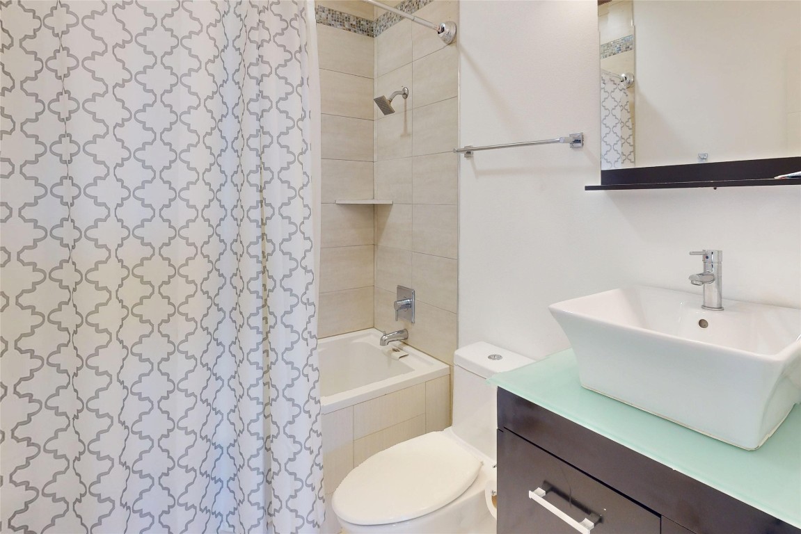 2023 Rosedale Street Houston, TX 77004 - Photo 18 of 30 a bathroom with a sink and a mirror