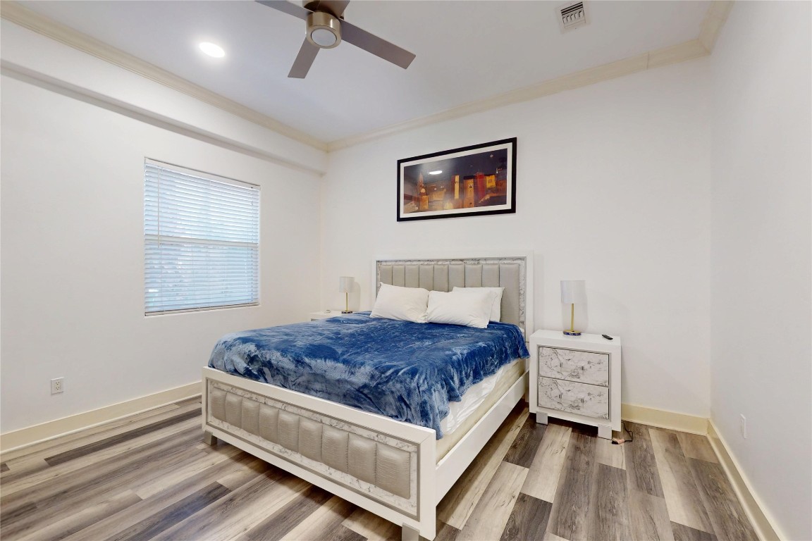 2023 Rosedale Street Houston, TX 77004 - Photo 23 of 30 a bedroom with a bed and a window
