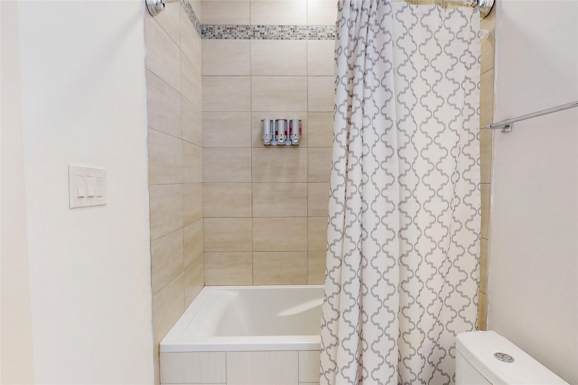 2023 Rosedale Street Houston, TX 77004 - Photo 24 of 30 a bathroom with a bathtub and shower