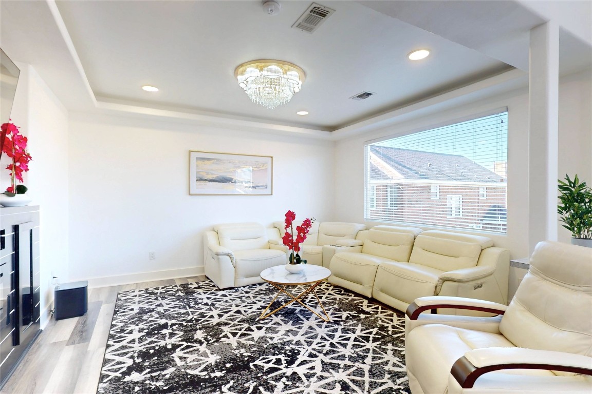 2023 Rosedale Street Houston, TX 77004 - Photo 9 of 30 a living room with a couch and a table