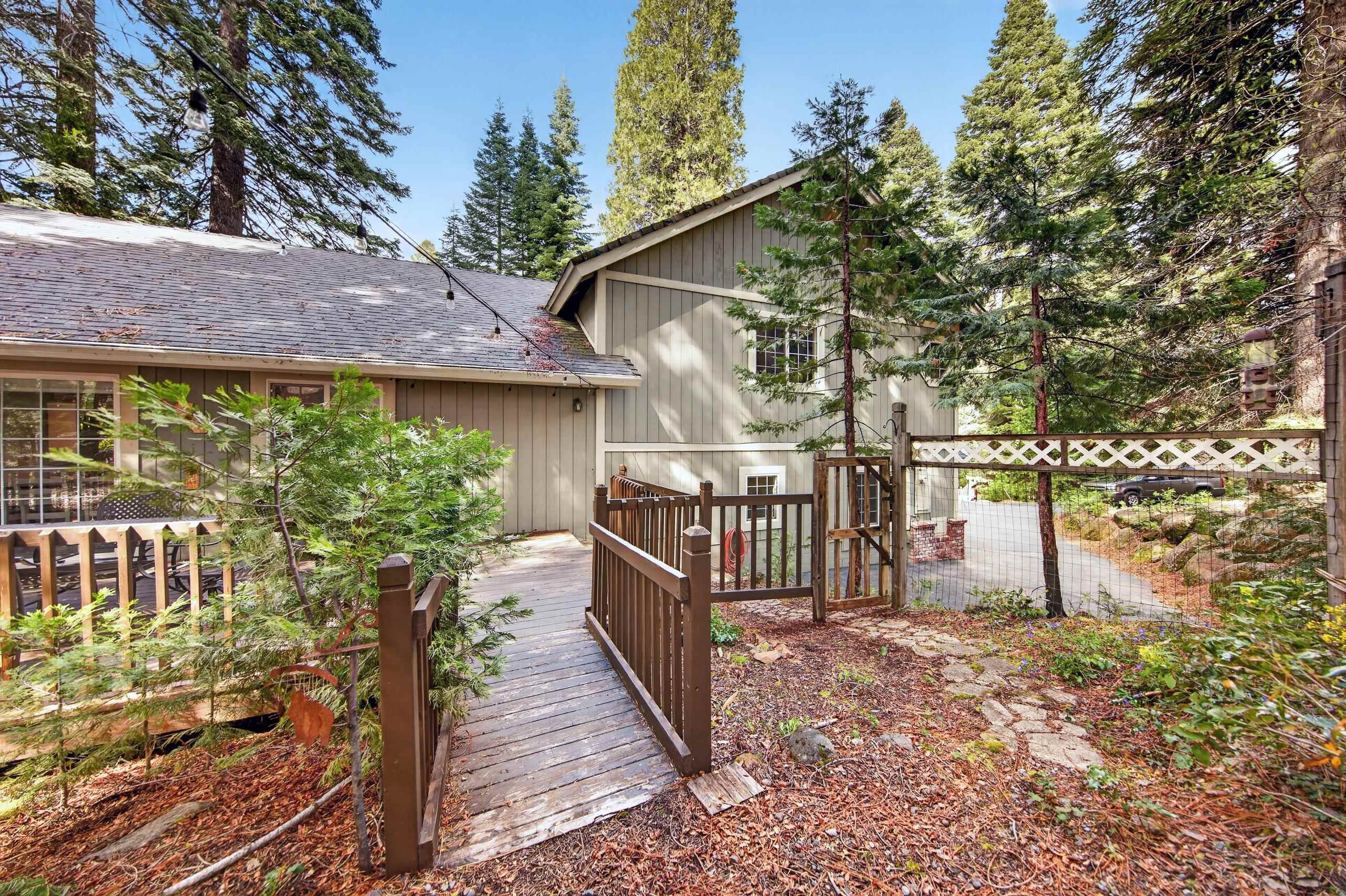 1220 Lynx Road Lake Almanor, CA 96137 - Photo 4 of 45 a view of a porch with a small yard