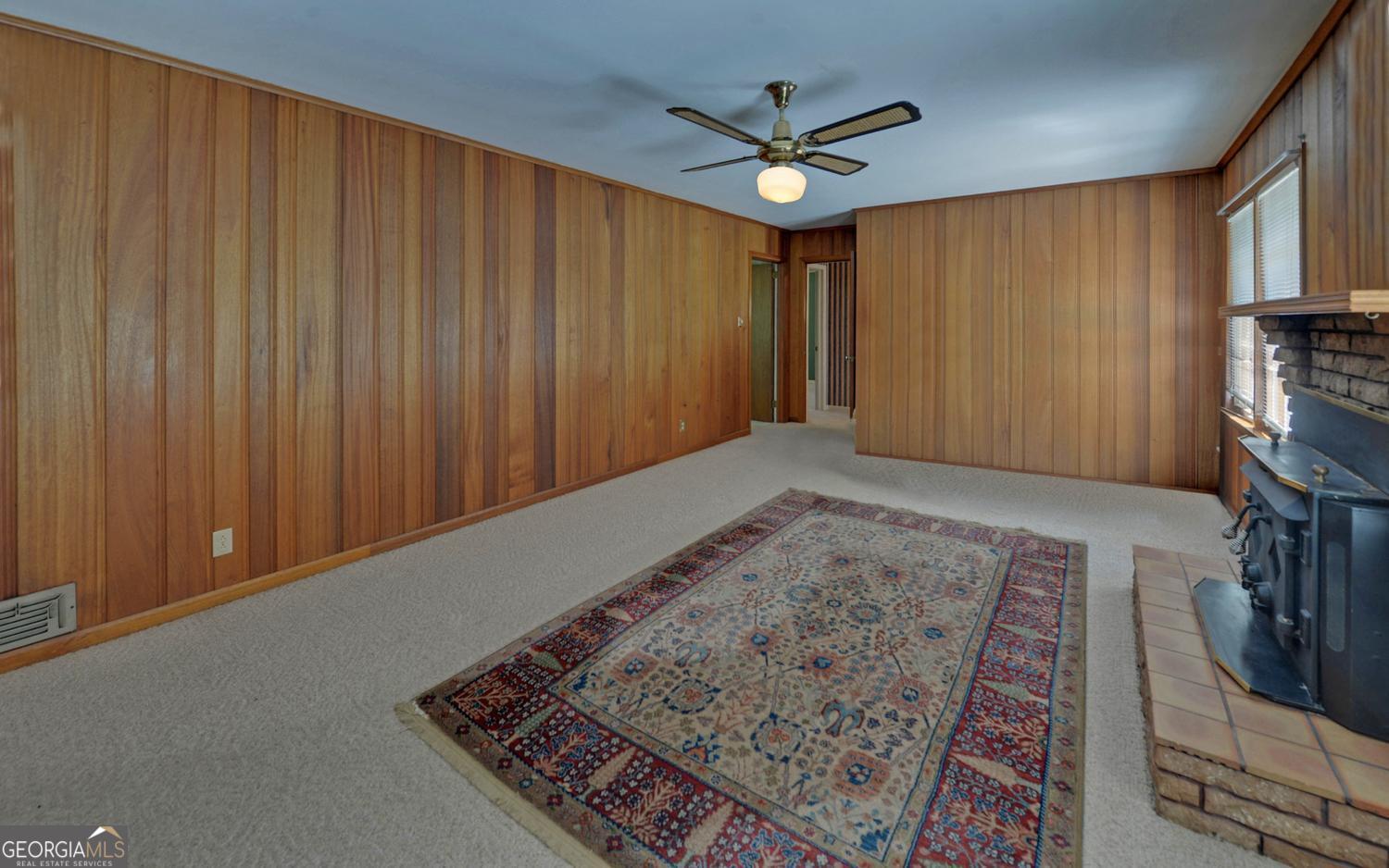 400 Harris Street Toccoa, GA 30577 - Photo 17 of 49 wooden floor in an empty room with a window