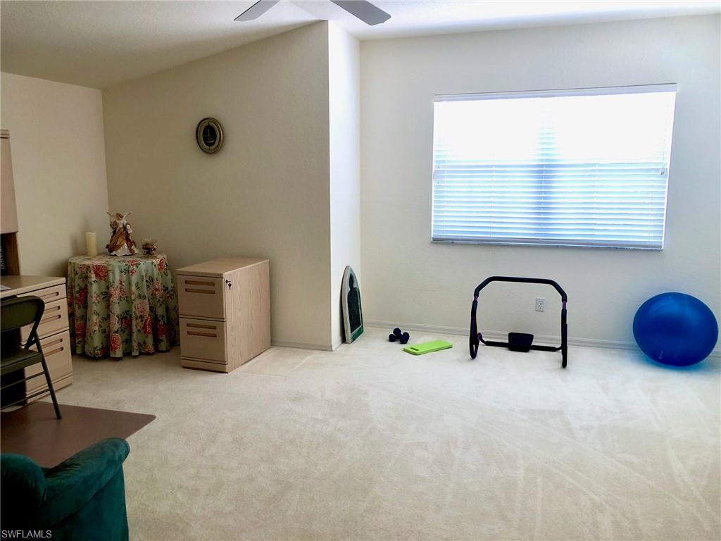 6879 Redbay Park Road, Unit 203 Naples, FL 34109 - Photo 16 of 34 a view of a room with gym equipment