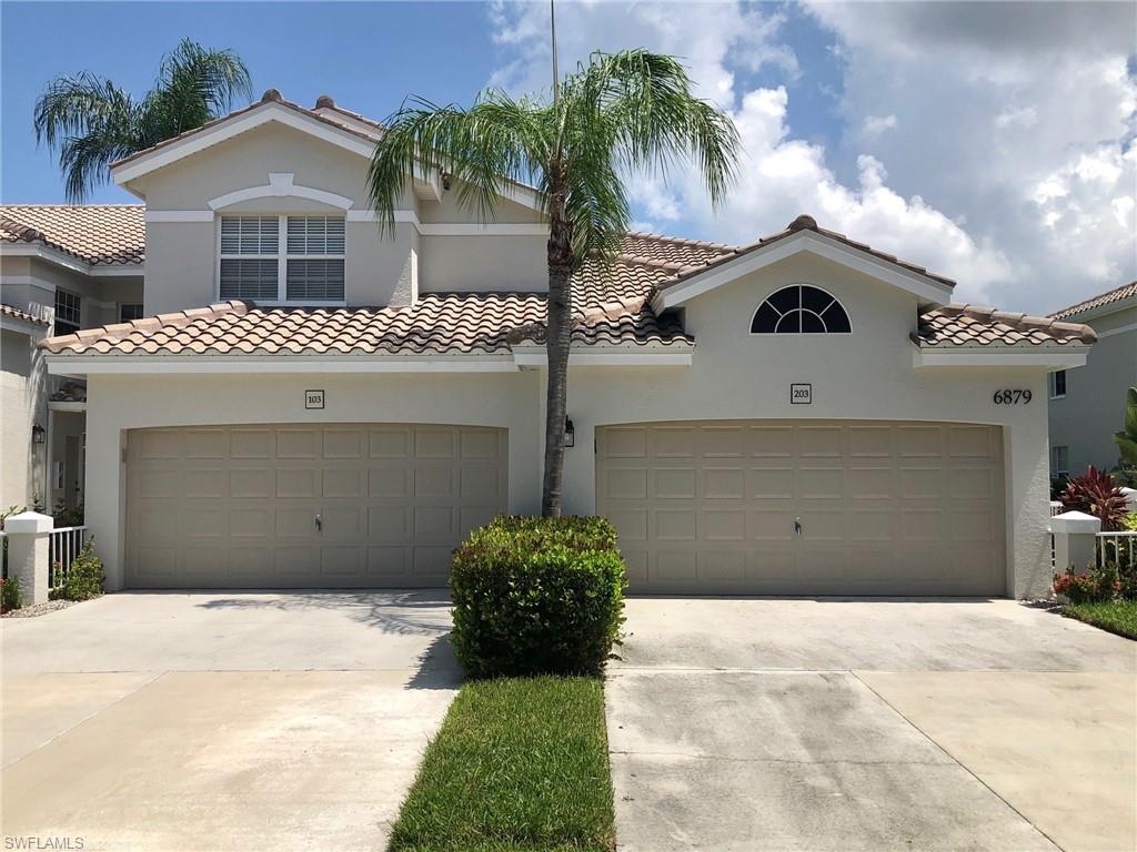 6879 Redbay Park Road, Unit 203 Naples, FL 34109 - Photo 2 of 34 a view of a house with a yard
