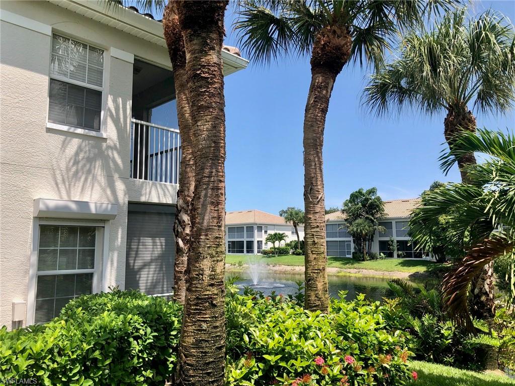 6879 Redbay Park Road, Unit 203 Naples, FL 34109 - Photo 3 of 34 a view of a back yard