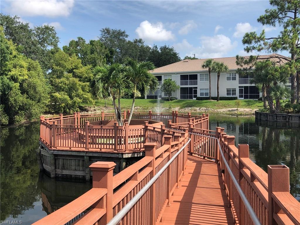 6879 Redbay Park Road, Unit 203 Naples, FL 34109 - Photo 34 of 34 a view of a patio with swimming pool