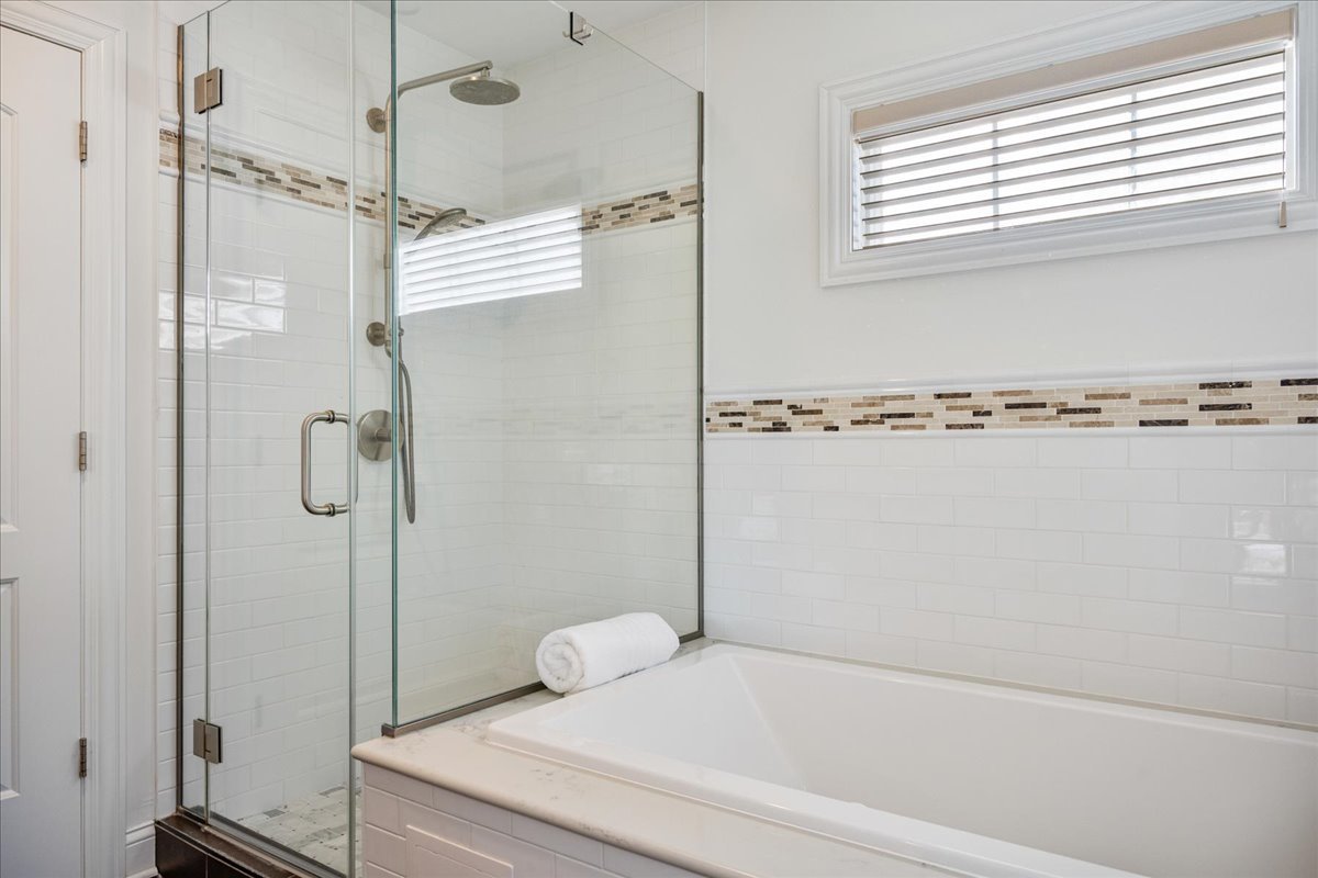924 Chestnut Avenue Wilmette, IL 60091 - Photo 22 of 41 a bathroom with a shower and a bath tub