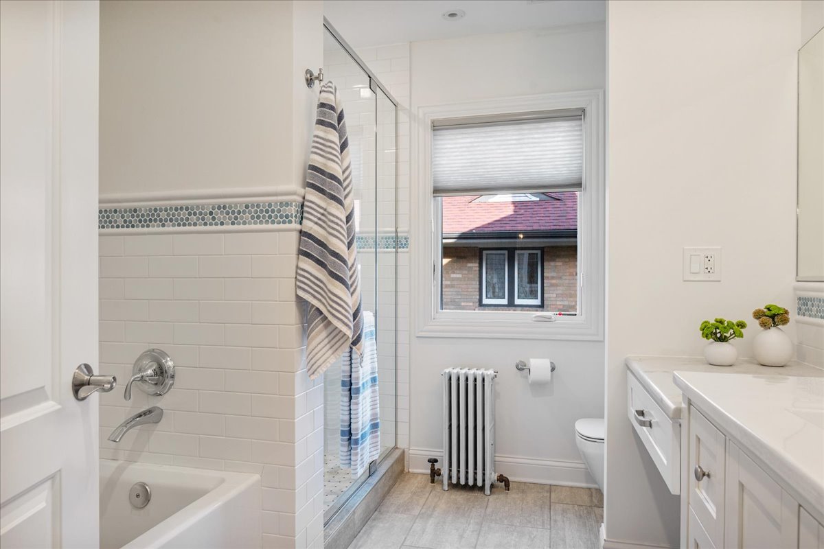 924 Chestnut Avenue Wilmette, IL 60091 - Photo 25 of 41 a bathroom with a bathtub and a shower