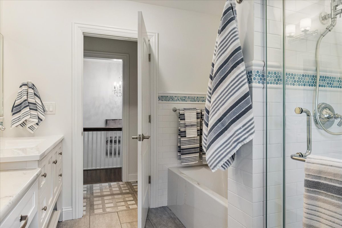 924 Chestnut Avenue Wilmette, IL 60091 - Photo 27 of 41 a bathroom with a sink a mirror and a shower