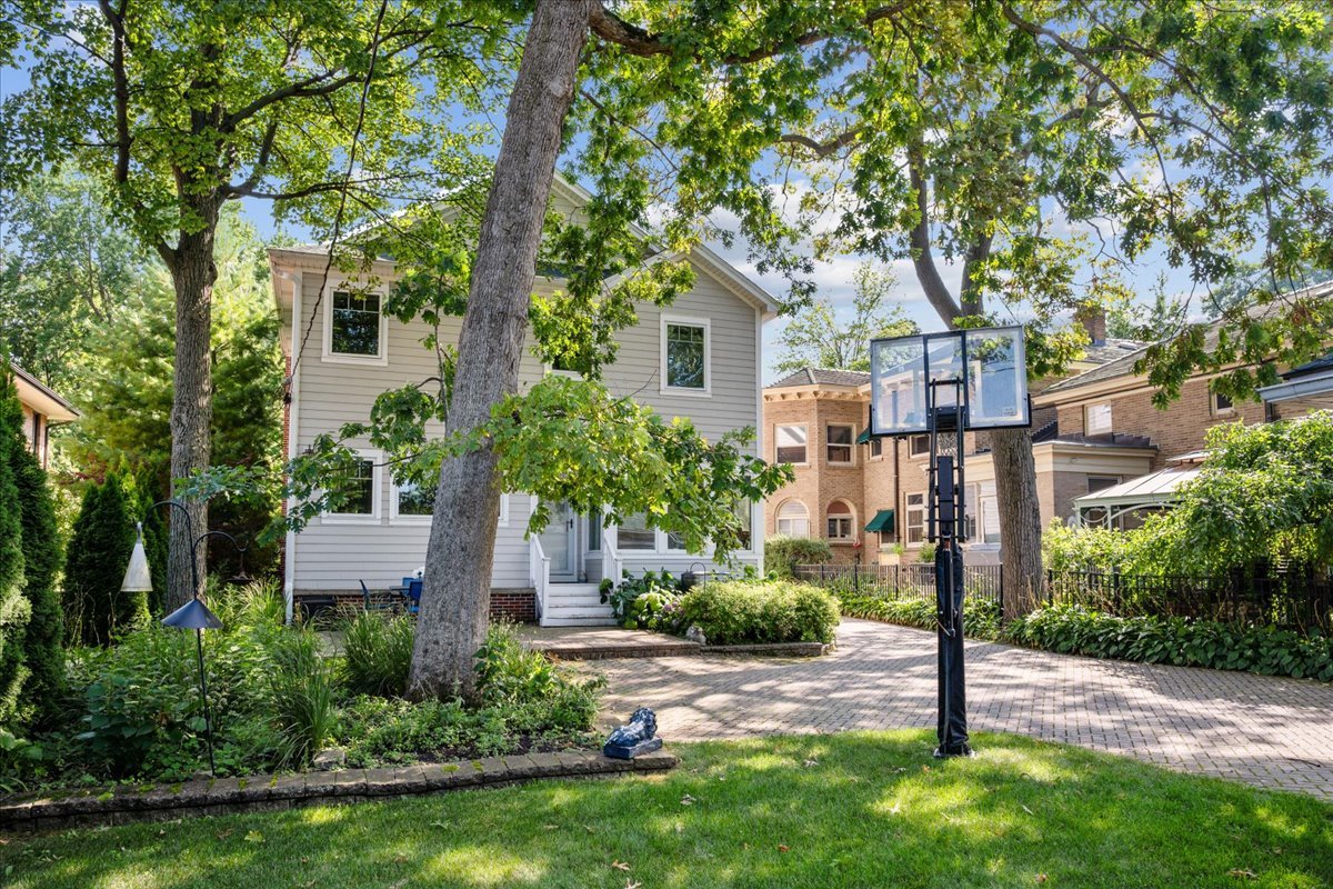 924 Chestnut Avenue Wilmette, IL 60091 - Photo 37 of 41 a front view of a house with a yard and tree s
