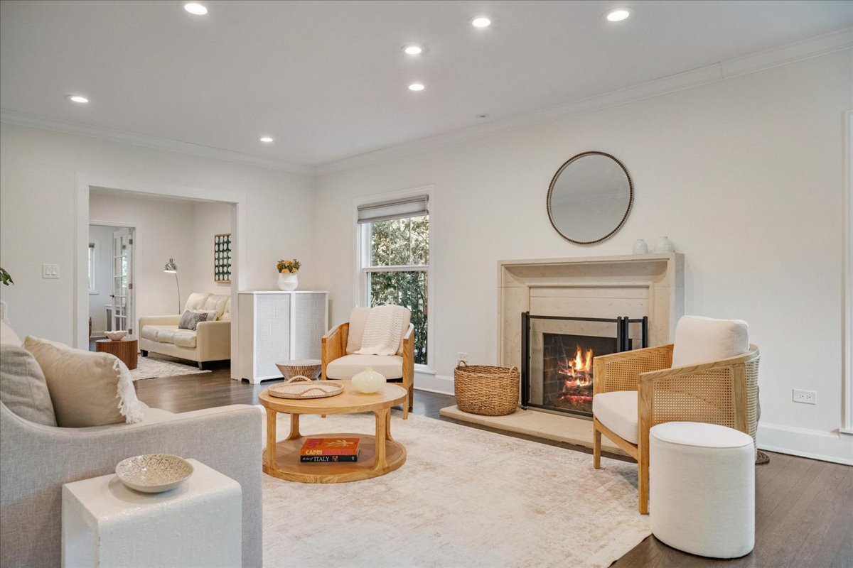 924 Chestnut Avenue Wilmette, IL 60091 - Photo 6 of 41 a living room with furniture a fireplace and a potted plant
