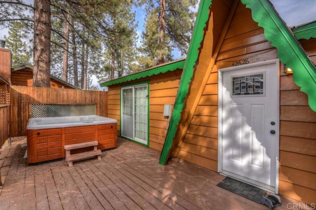 a view of backyard with tub and wooden floor