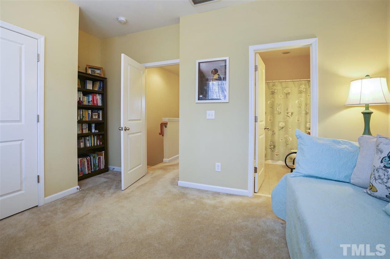 746 Wickham Ridge Road Apex, NC 27539 - Photo 12 of 22 a living room with closet and a bathroom