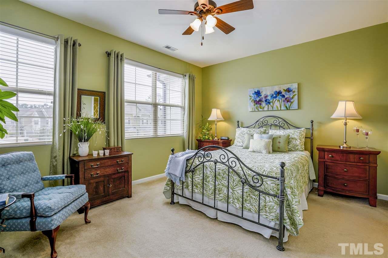 746 Wickham Ridge Road Apex, NC 27539 - Photo 14 of 22 a bedroom with a bed and window