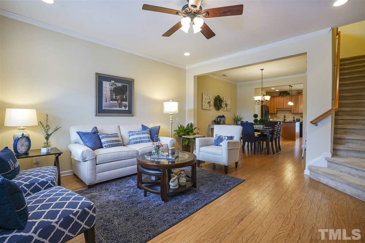 746 Wickham Ridge Road Apex, NC 27539 - Photo 3 of 22 a living room with furniture and wooden floor