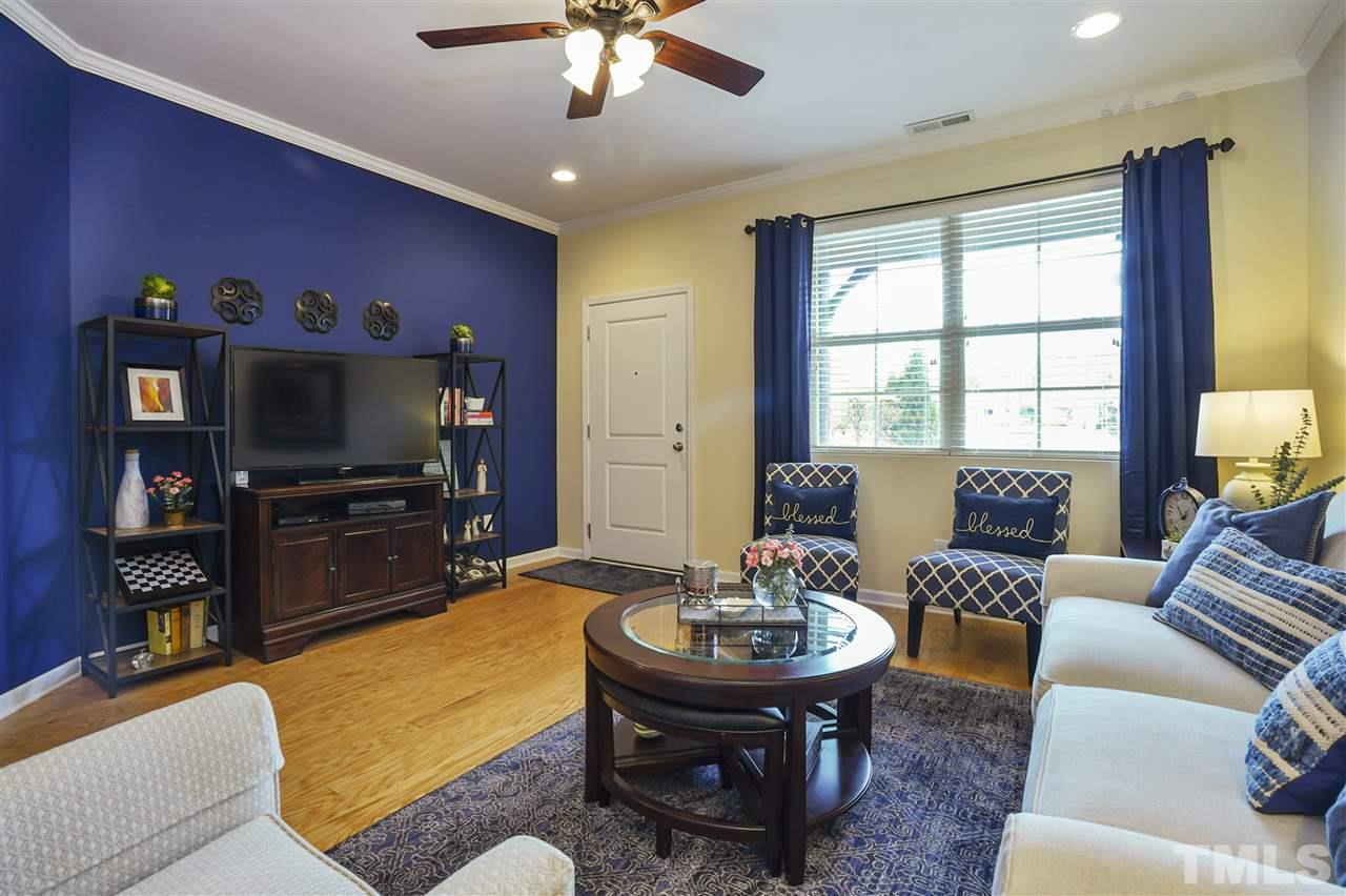 746 Wickham Ridge Road Apex, NC 27539 - Photo 4 of 22 a living room with furniture and a flat screen tv