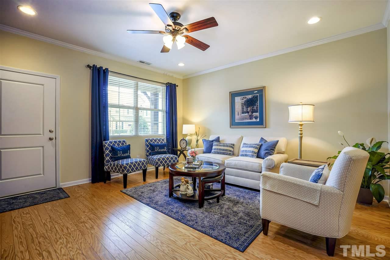746 Wickham Ridge Road Apex, NC 27539 - Photo 5 of 22 a living room with furniture and wooden floor