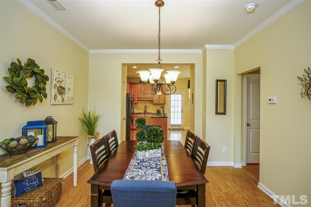 746 Wickham Ridge Road Apex, NC 27539 - Photo 6 of 22 a view of a livingroom with furniture window and wooden floor