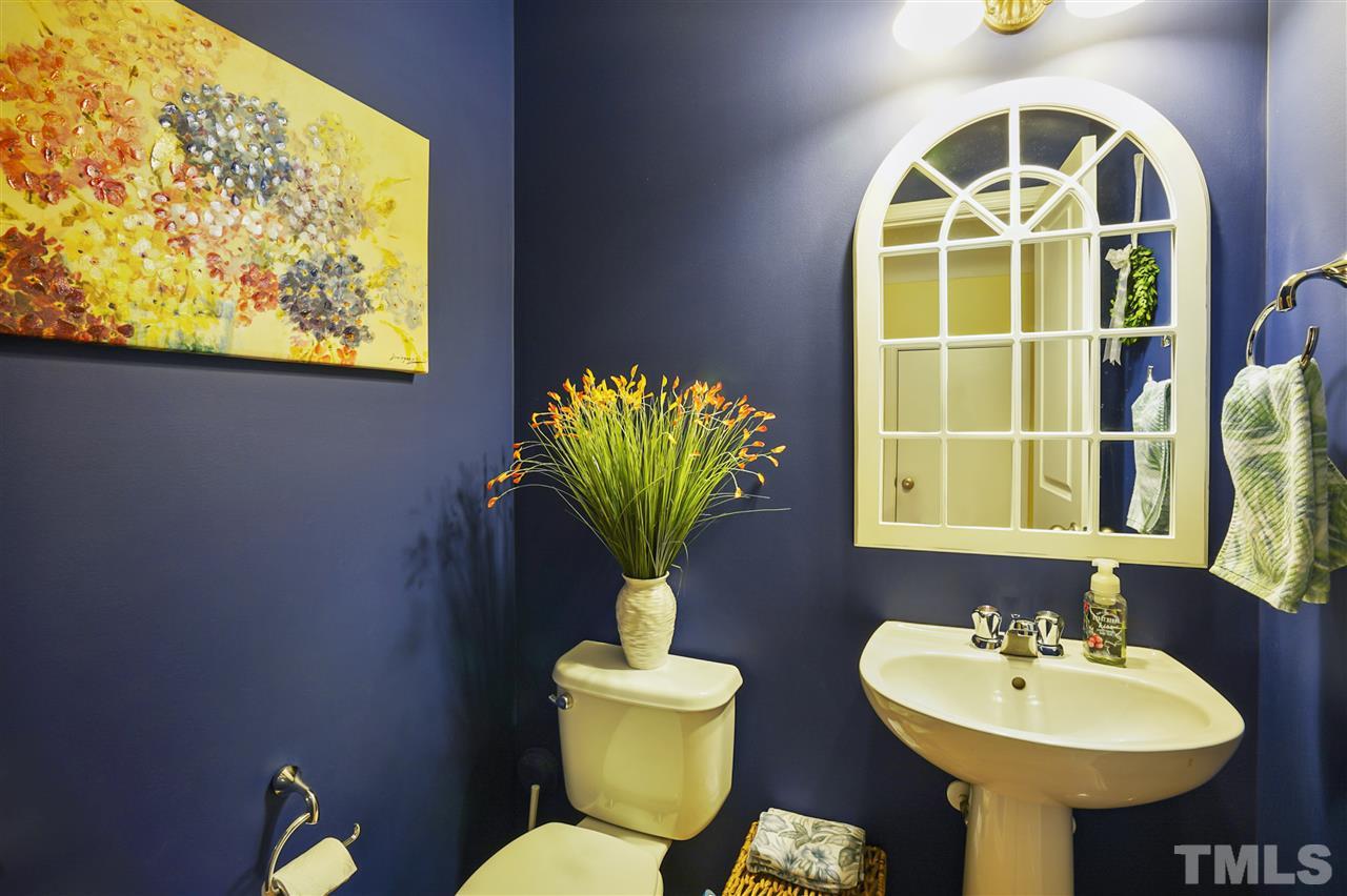 746 Wickham Ridge Road Apex, NC 27539 - Photo 10 of 22 a bathroom with a sink and a mirror