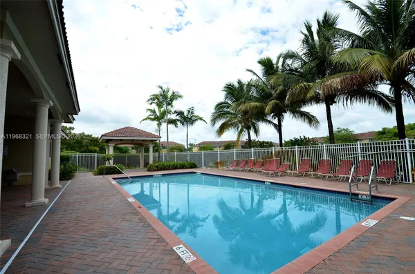 swimming pool view with a outdoor seating