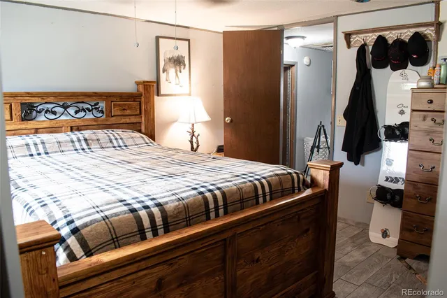 a bedroom with a bed and a dresser