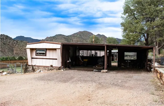 a view of a car park in front of house