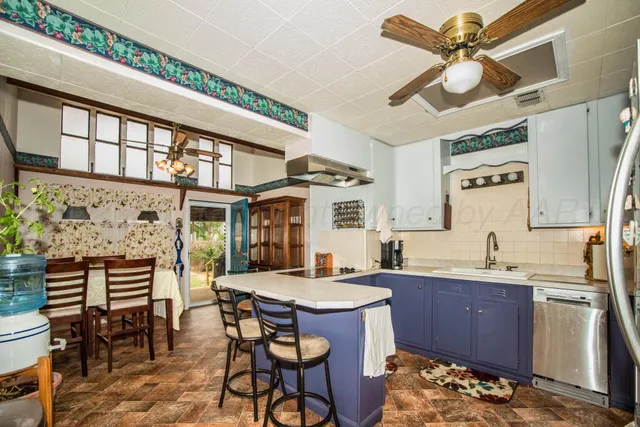a kitchen with a dining table and chairs