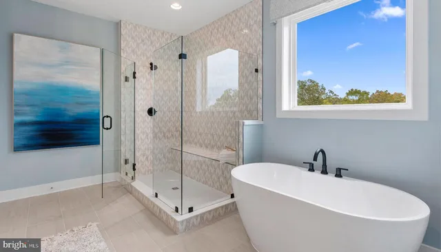 a white bath tub sitting next to a bathroom