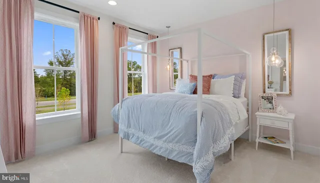 a spacious bedroom with a bed and a window