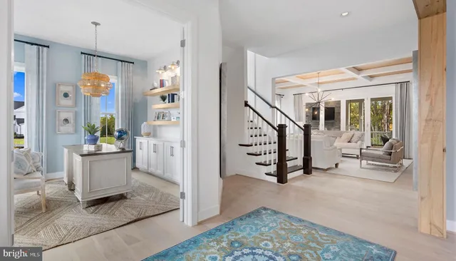 a living room with furniture and a painting on the wall